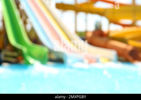 Different colorful slides in water park, blurred view Stock Photo