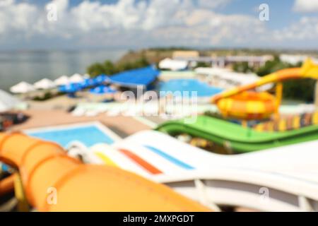 Different colorful slides in water park, blurred view Stock Photo
