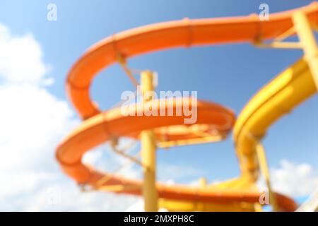 Different colorful slides in water park, blurred view Stock Photo
