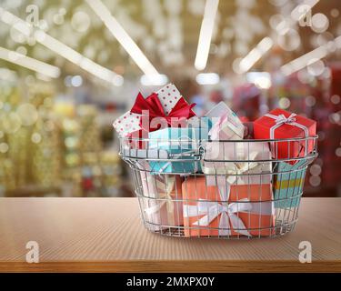 Boxing day concept. Shopping basket with gifts in supermarket Stock Photo