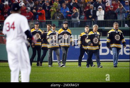 Boston Bruins hockey legend Bobby Orr, center, reaches out to former Boston Red  Sox's Bill Buckner, center, as former Red Sox's Dwight Evans, left, Red Sox  Chairman and co-owner Tom Werner, second