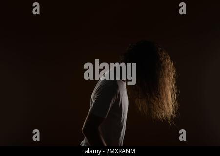 Male with long curly hair. Studio shoot Stock Photo