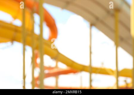 Different colorful slides in water park, blurred view Stock Photo