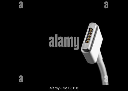 Charge cable on black background, closeup. Space for text Stock Photo
