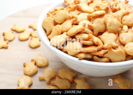 Delicious goldfish crackers in bowl, closeup view Stock Photo