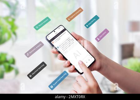 Smart phone using a chatbot app and  flying concept boxes representing semantic analysis, deep learning, and neural networks. Showcases the integratio Stock Photo