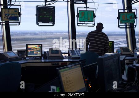 An FAA Air Traffic Controller works in the Dulles International Airport ...