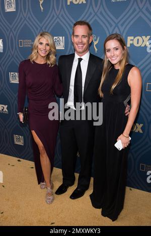 Michelle Beisner left Joe Buck and Trudy Buck attend the Fox