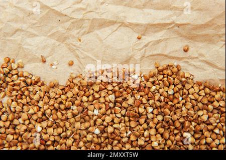 background with rice grains on crumpled old parchment wrapping paper ...