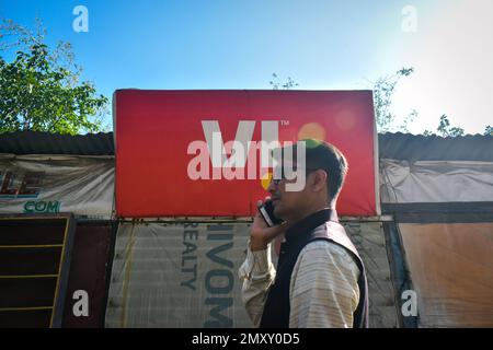 Kolkata, India. 04th Feb, 2023. A person talking on his mobile in front of a Vodafone retail store on the outskirts of Kolkata. The government has agreed to convert Vodafone Idea's accrued interest worth over Rs 16,000 crore on deferred adjusted gross revenue (AGR) dues into equity at Rs 10 a share. The move came after the government received an assurance from the promoters of the carrier that they are committed to the company and will bring in the necessary funds. (Photo by Sudipta Das/Pacific Press) Credit: Pacific Press Media Production Corp./Alamy Live News Stock Photo