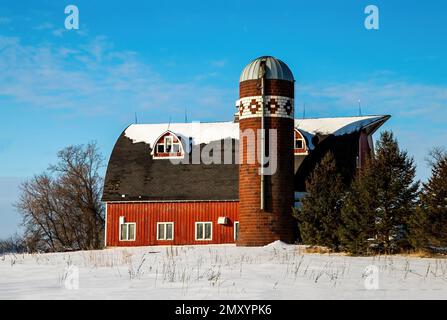 Red barn with a vintage brick silo in Scandia, Minnesota. Stock Photo