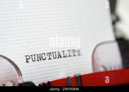 Punctuality word written with a typewriter. Stock Photo