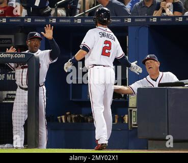 The Braves' Dansby Swanson high fives teammates prior to a game against the  Arizona Diamondbacks on Monday, Aug…