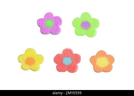 Pastel tone multi-colored flower shaped marshmallow candies isolated on white background Stock Photo