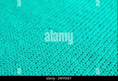 Vibrant Turquoise Blue Alpaca Knitted Wool Fabric in Diagonal Patterns for Abstract Background Stock Photo