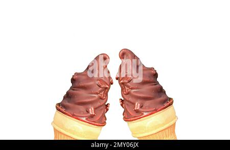 Pair of Chocolate Coated Soft Serve Ice Cream Cones Clinking on White Background Stock Photo