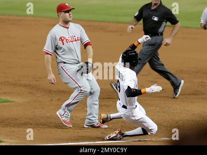 Miami Marlins' Dee Gordon adjusts his gloves during warmups before the  start of a baseball game against the Pittsburgh Pirates, Friday, April 28,  2017 in Miami. (AP Photo/Wilfredo Lee Stock Photo - Alamy