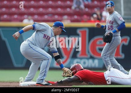 Cincinnati Reds' Brandon Phillips, right, is greeted at home plate by  teammate Royce Clayton (2) after hitting a home run off Los Angeles Dodgers  pitcher Mark Hendrickson in the second inning of