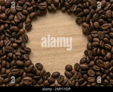 Coffee beans on wooden background with copy space. Stock Photo