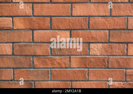 Reddish brown brick wall background. Stock Photo
