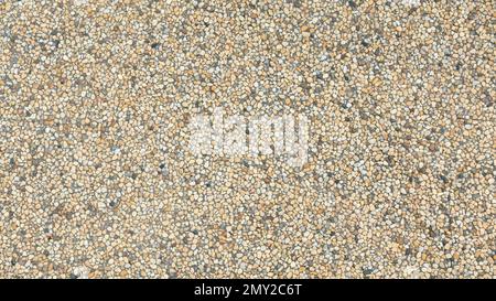 Abstract background paving consisting of small pebbles embedded in cement Stock Photo