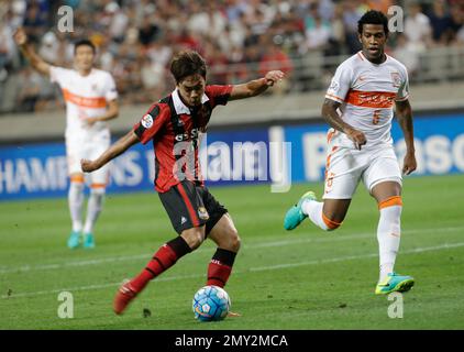 Dejan Damjanovic of South Korea's FC Seoul, left, shoots against China's  Shandong Luneng during their Group F match of the AFC Champions League 2016  i Stock Photo - Alamy