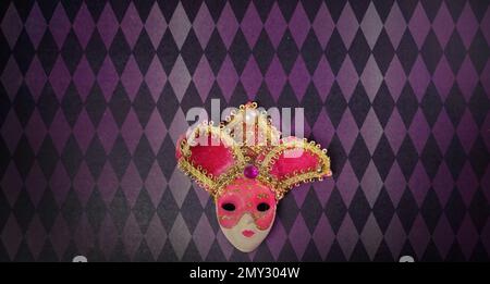 mardi gras carnival, wallpaper venetian mask, purple pink gradient rhombus pattern background Stock Photo