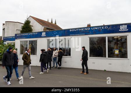 Southend on Sea, Essex, UK. 4th Feb, 2023. A protest is taking place at Southend United football club prior to their match against York City in the National League. The fans blame chairman Ron Martin for not investing in the club, for repeated relegations & fears that a forthcoming HMRC winding-up petition may go unpaid & risk the club’s survival. Protesters gathered in the High Street before marching to the club’s Roots Hall ground. Some staff’s wages and service bills have not been paid. Supporters entering ground and waiting outside merchandise shop Stock Photo