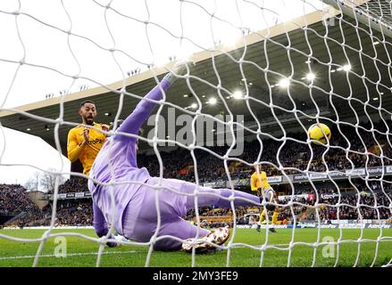 Liverpool goalkeeper Alisson Becker fails to stop team-mate Joel Matip (not pictured) from scoring an own goal during the Premier League match at Molineux Stadium, Wolverhampton. Picture date: Saturday February 4, 2023. Stock Photo