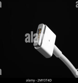 Charge cable on black background, closeup. Space for text Stock Photo