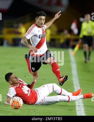 Rafinha of Brazil's Flamengo heads the ball challenged by Milton Casco of  Argentina's River Plate during the Copa Libertadores final soccer match at  the Monumental stadium in Lima, Peru, Saturday, Nov. 23