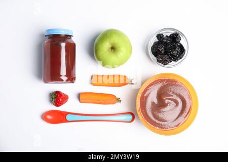 Flat lay composition with healthy baby food and ingredients on white background Stock Photo