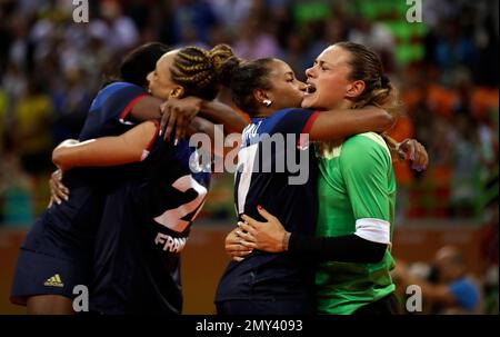 France s Laura Glauser right hugs France s Estelle Nze Minko