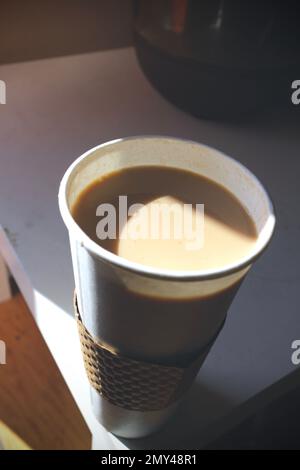 Latte Sits In Morning Light Stock Photo