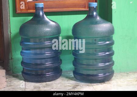 Two gallons of water measuring 19 liters made of high-quality blue plastic, in the photo when empty, there is no water in it Stock Photo