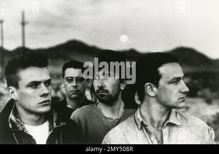 Members of the Irish pop rock band U2: from left Adam Clayton, Larry Mullen, the Edge and Bono, UK 1980s Stock Photo