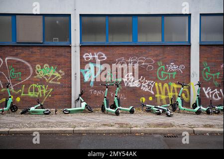 21.11.2022, Berlin, Germany, Europe - Parked Bolt electric scooters are seen standing and lying on the roadside near Bahnhof Zoo station. Stock Photo