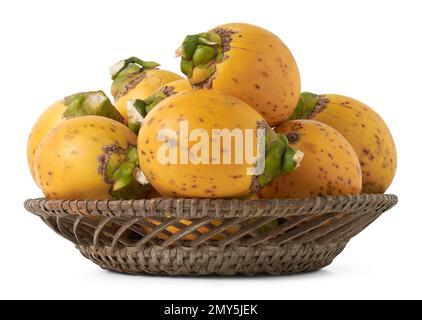 fresh and yellow husk areca nuts on a tray, fruit of the areca palm, areca nut palm or betel palm, tropical and commercially important fruits isolated Stock Photo