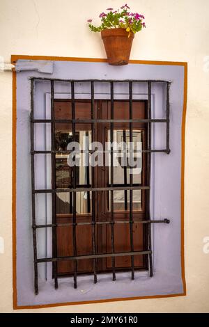 Closed window with metal bars on a alley, Córdoba, Andalucia, Spain Stock Photo