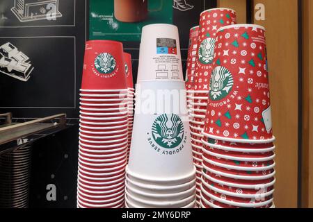 Avranches, France - January 25 2023: Stack of Starbucks cardboard coffee cups at a motorway service station coffee stand. Stock Photo