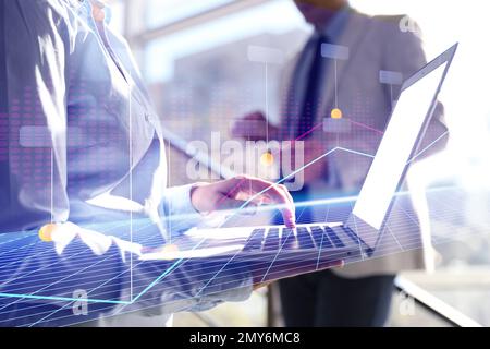 Forex trading. Double exposure of charts and people using devices, closeup Stock Photo