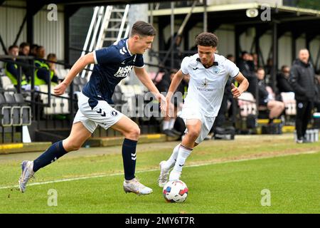 Swansea, Wales. 4 February 2023. Oliver Evans of Millwall under pressure  from Zane Myers of Swansea City during the Professional Development League  game between Swansea City Under 18 and Millwall Under 18
