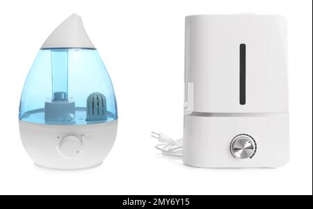 Two modern air humidifiers on white background Stock Photo
