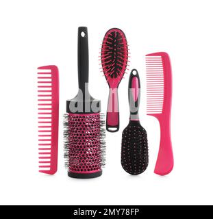 Set of professional hair brushes and combs isolated on white, top view Stock Photo