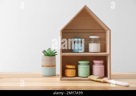 Inside of an artist storage cabinet with a variety of oil and acrylic  paints in an artist's studio Stock Photo - Alamy