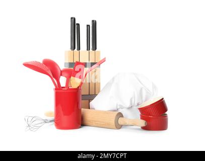 Set of different cooking utensils and chef's hat on white background Stock Photo