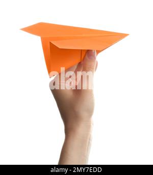 Woman holding orange paper plane on white background, closeup Stock Photo