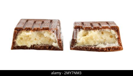 The chocolate bar is broken into pieces. Candy with milk filling Stock Photo