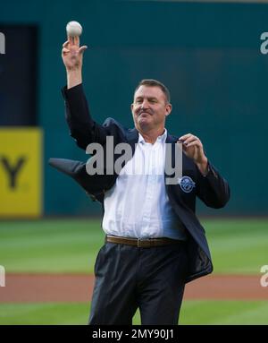 Former Oakland Athletics star and Hall of Famer Reggie Jackson, left,  stands with Josh Reddick in right field and acknowledges the crowd as the  1973 World Series championship team is honored in