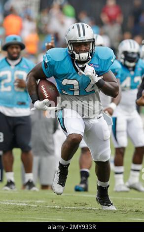 Carolina Panthers running back Cameron Artis-Payne (34) crosses the goal  line against New Orleans Saints cornerback Marshon Lattimore (23) on a  tcoudhown carry in the first half of an NFL football game